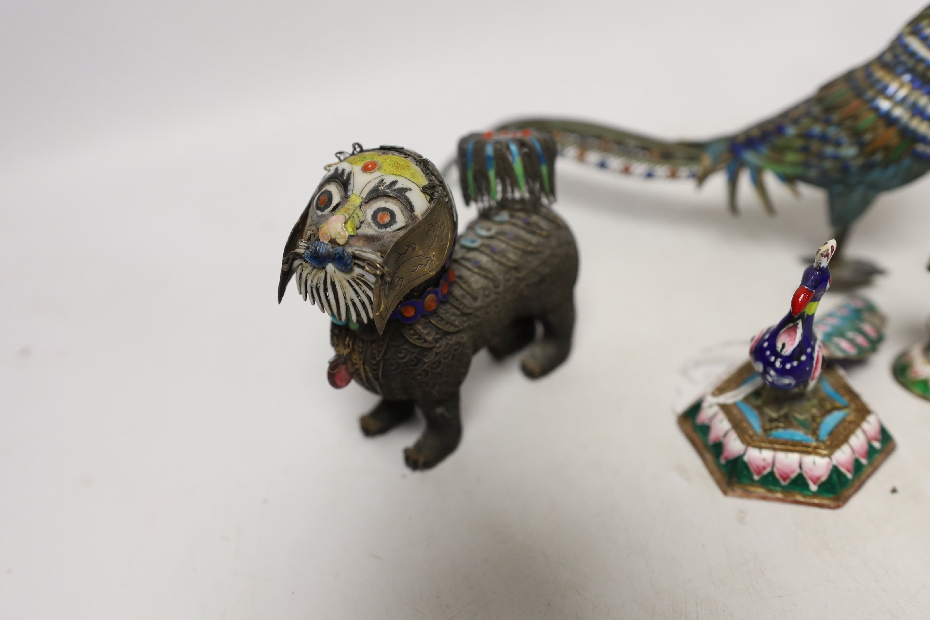 A Chinese white metal enamel pheasant, two similar lions, a cloisonné enamel pot and two Indian enamel figures